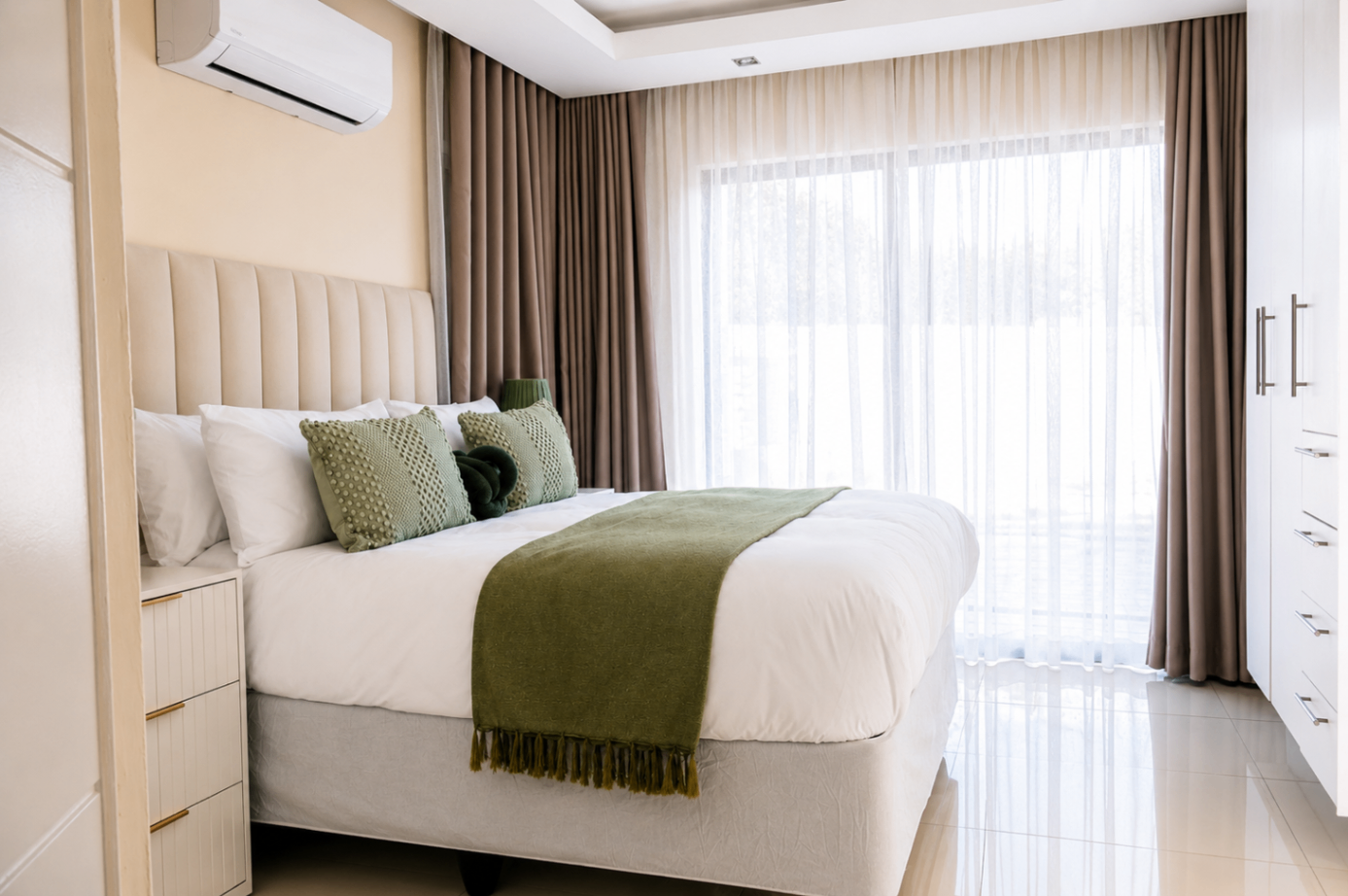 Bedroom with sheer curtains and natural light