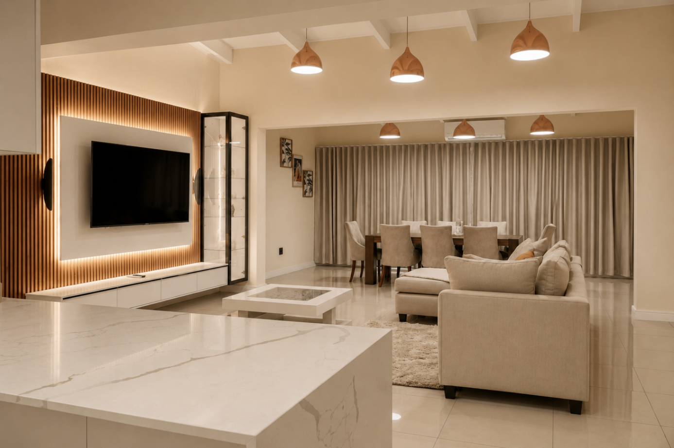 Living room with backlit timber TV wall and marble island