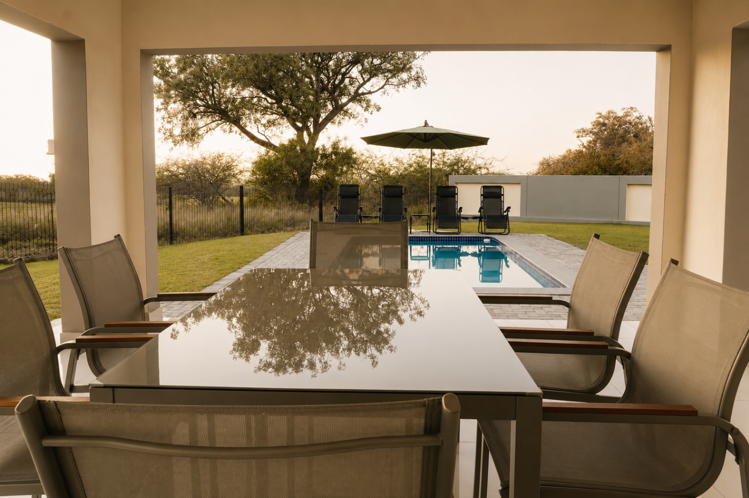 Covered patio dining looking through to the pool